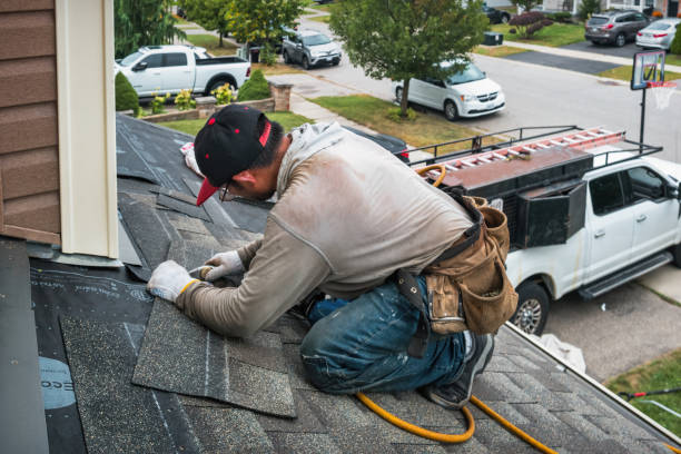 Professional Roofing technician working in Morganville, NJ